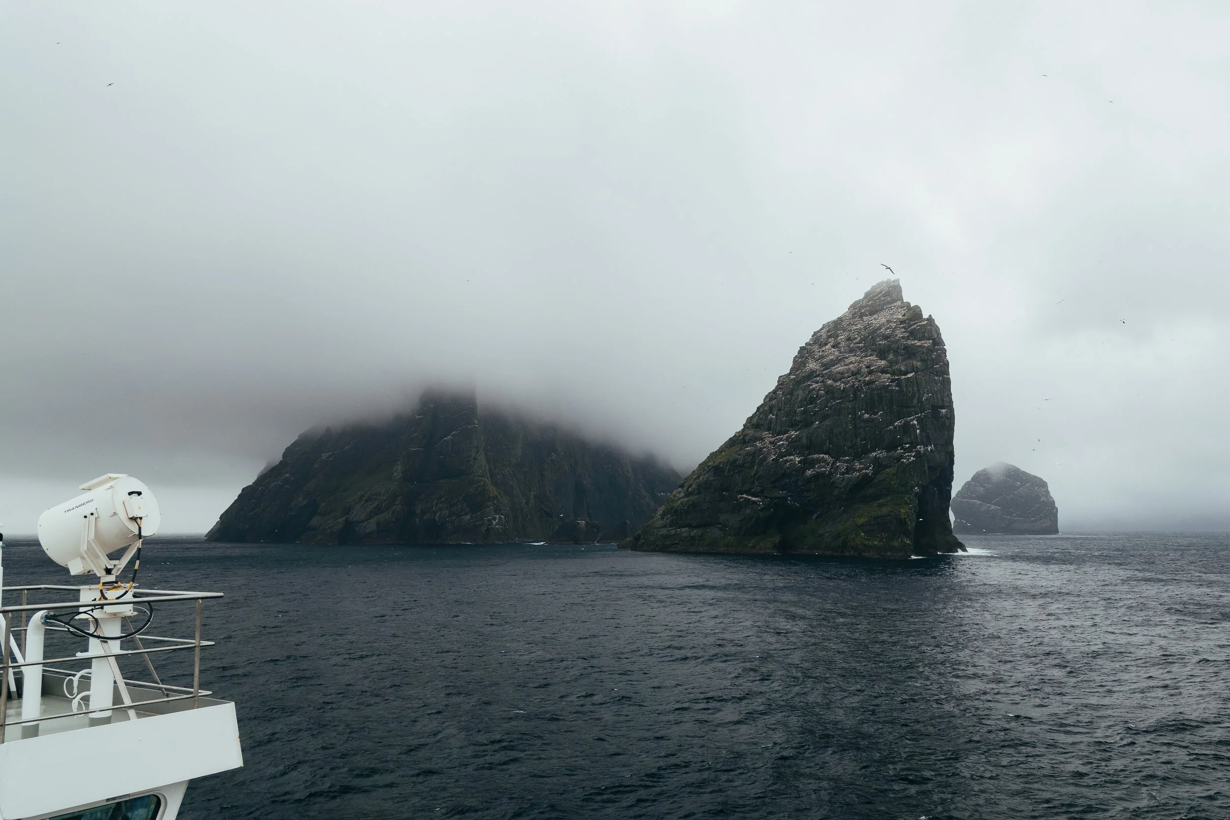 Sea stacks fading into low cloud