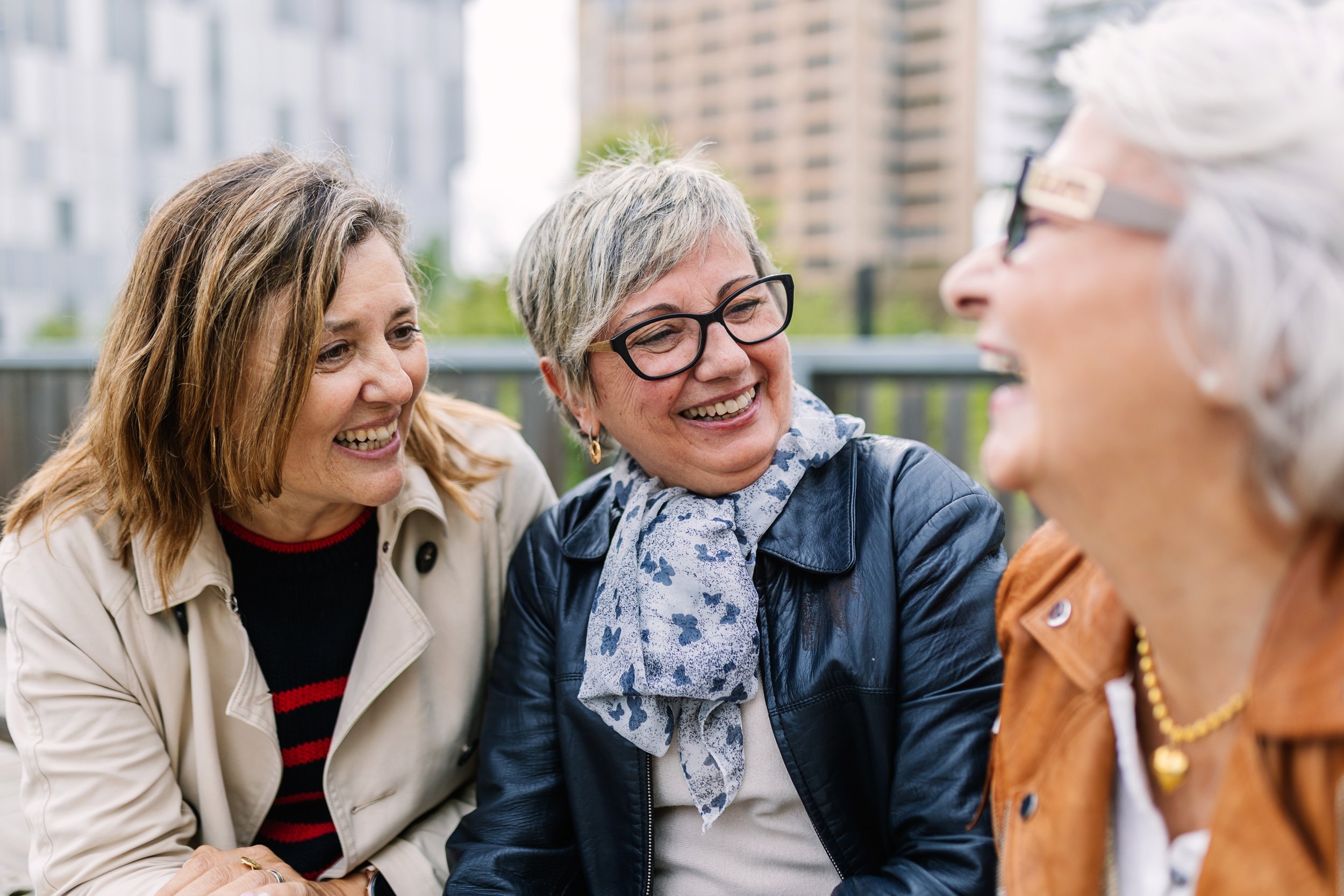 three-smiling-women-enjoying-time-together-outdoor-2026-09-22-01-13-47-utc.jpg
