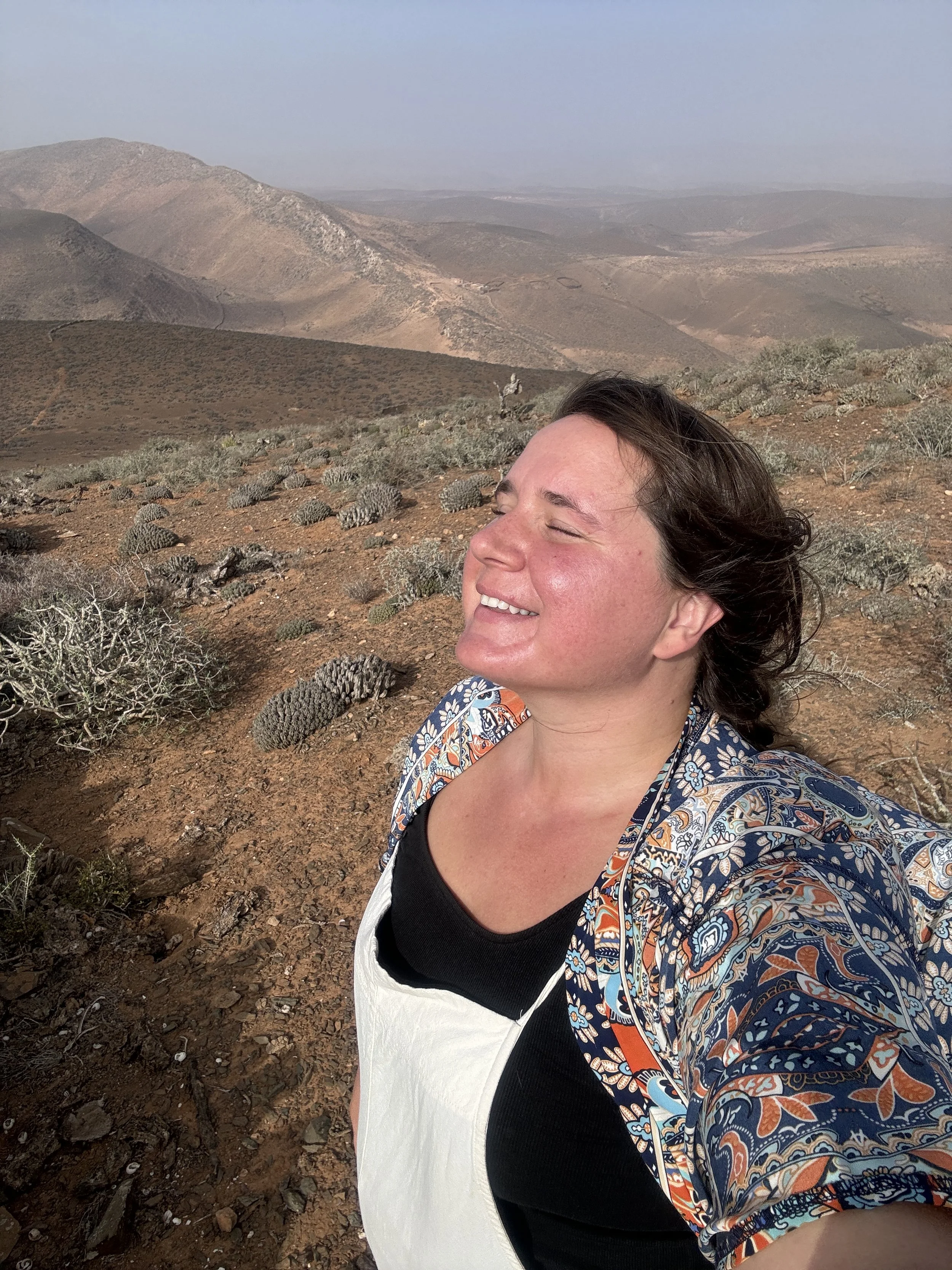 Annie, traveling psychologist standing in nature.