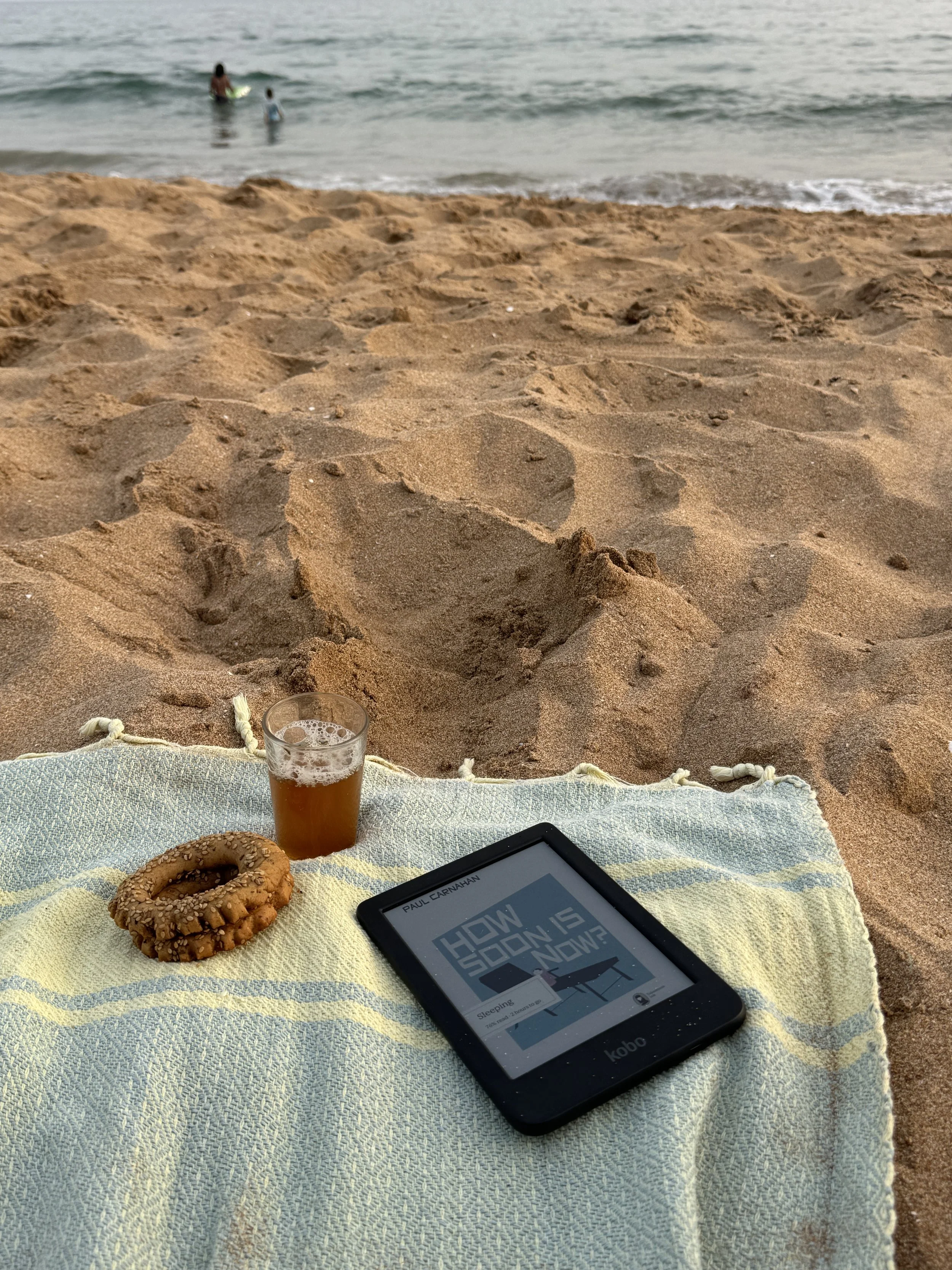 Reading on the beach, which is something you can do as a remote therapist.