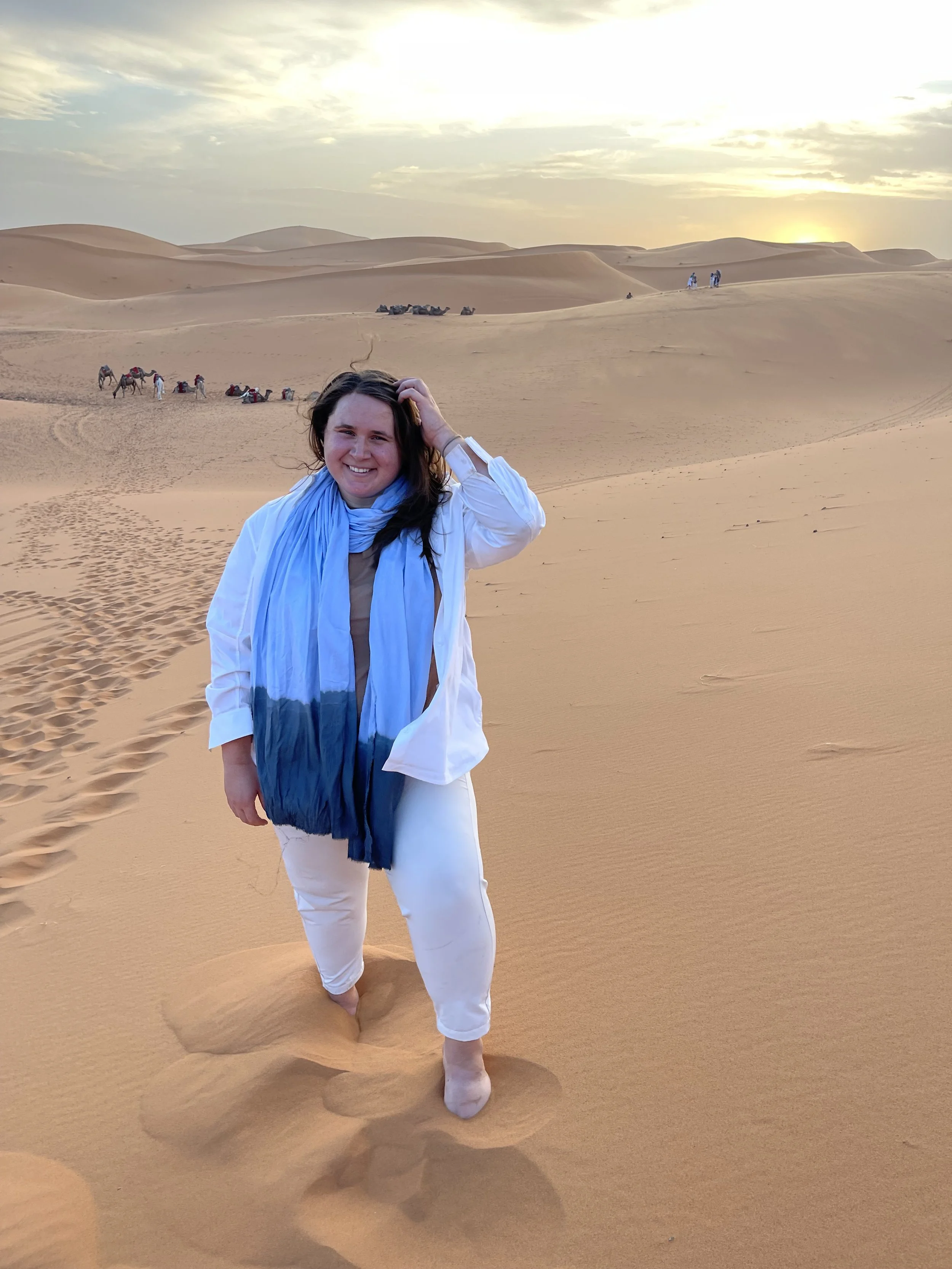 Annie, remote therapist, standing in desert.