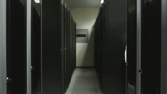 A data centre manager in a colocation facility giving prospective tenants a tour of the facility while he explains how Australian IT Services provides a professional technical clean of the data centre every quarter.