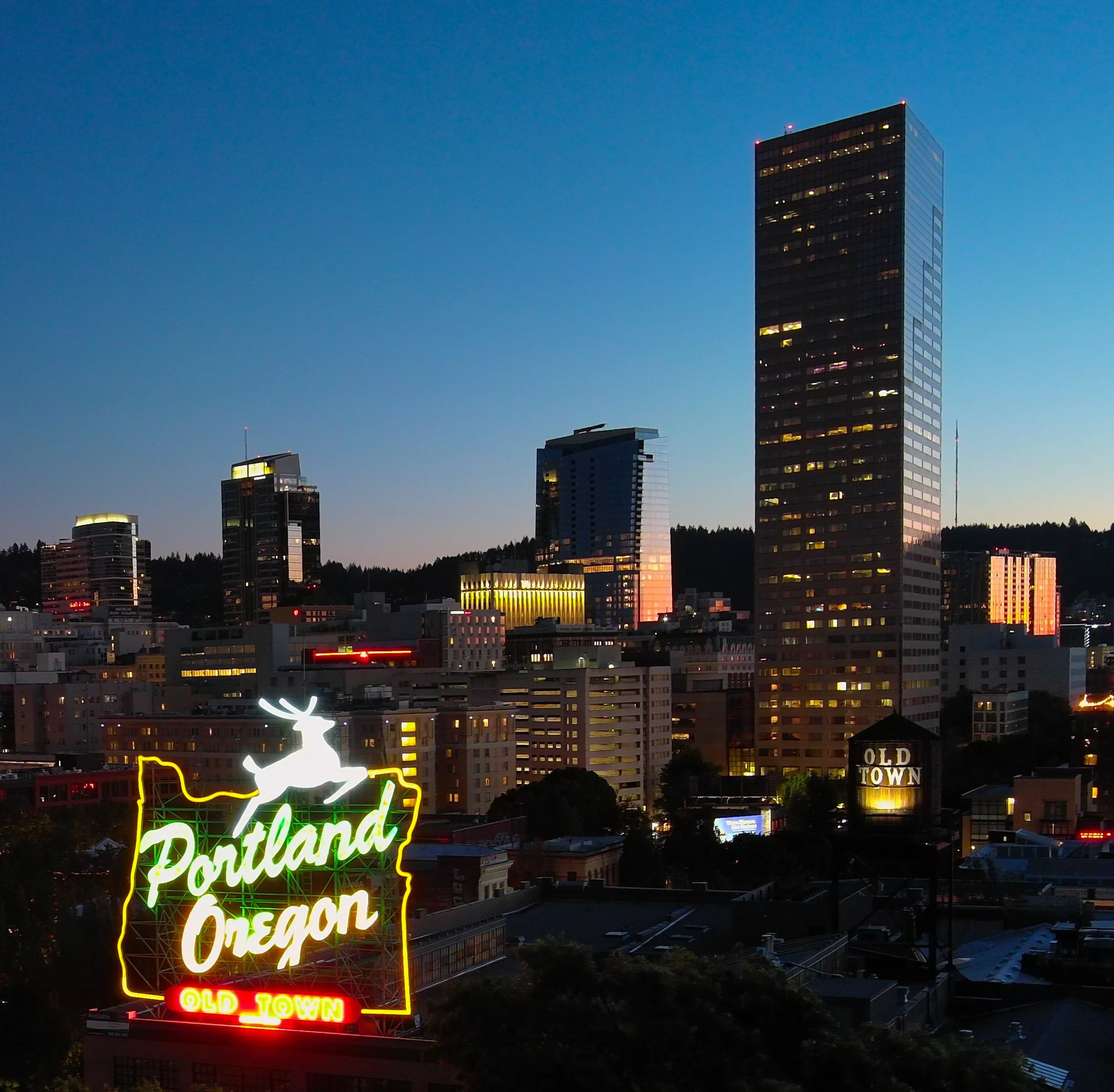 An aerial photograph of downtown Portland Oregon at sunset
