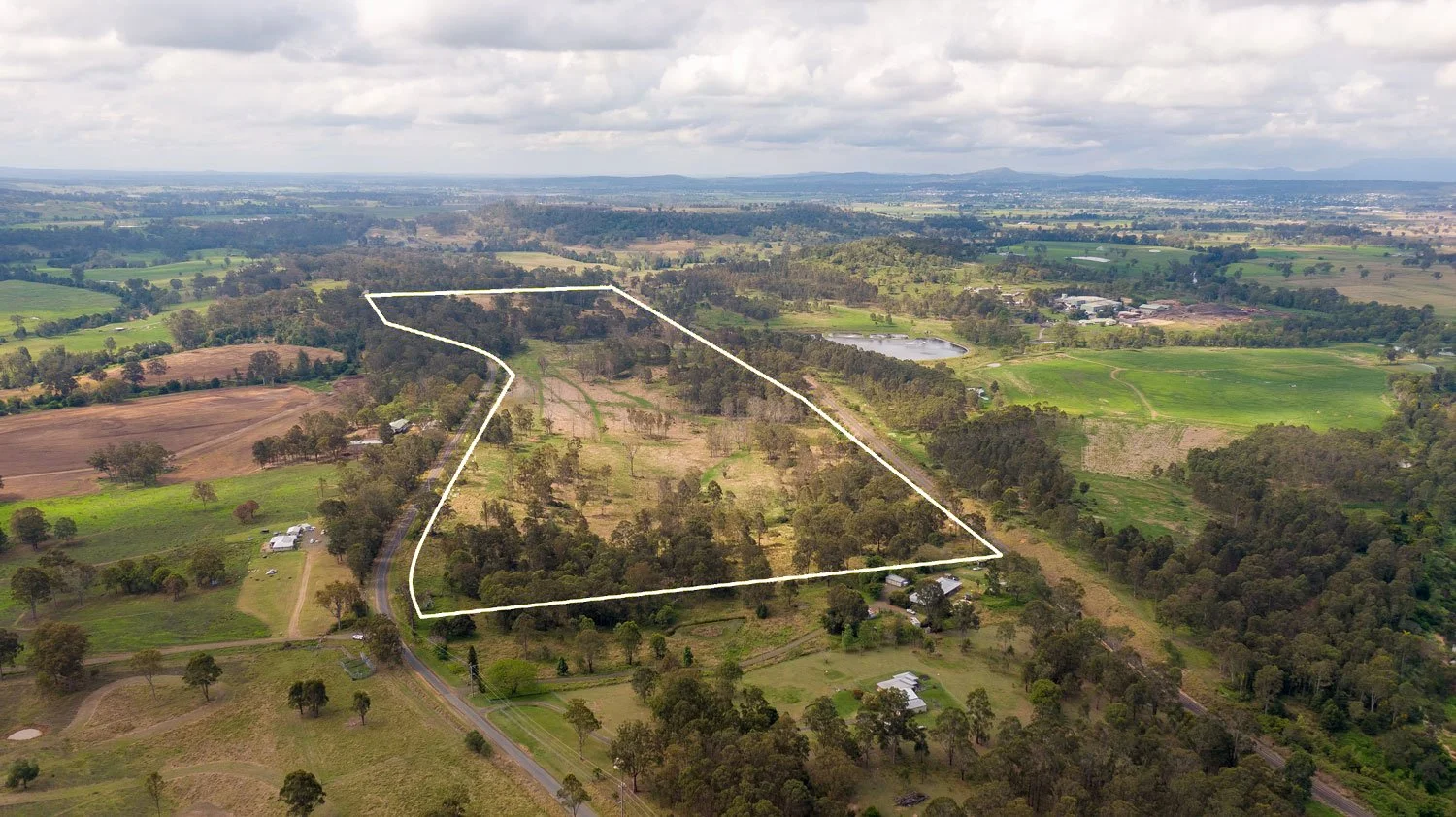 Aerial view of a rural landscape showing a large piece of land in the Bromelton State Development Area.