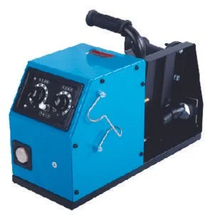 A blue industrial sewing machine with dials and a handle, mounted on a black base.