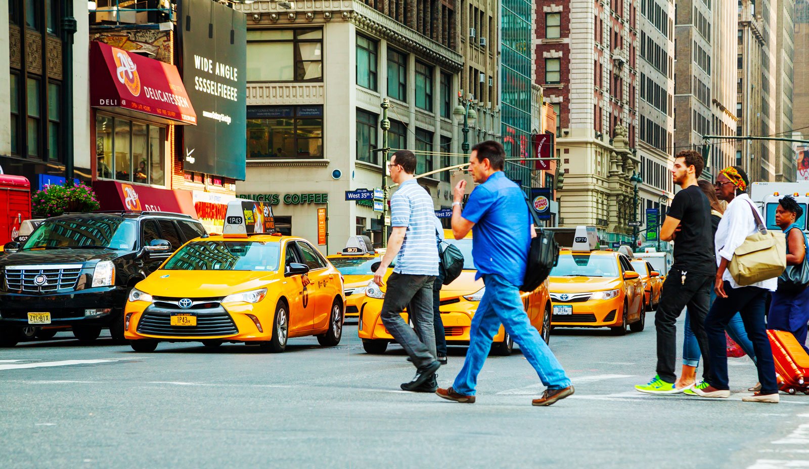 NYC-people-in-front-of-yellow-cabs.jpg