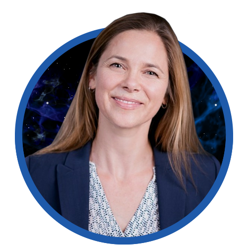 Portrait of a woman smiling, wearing a blazer and patterned blouse, set against a blue abstract background.