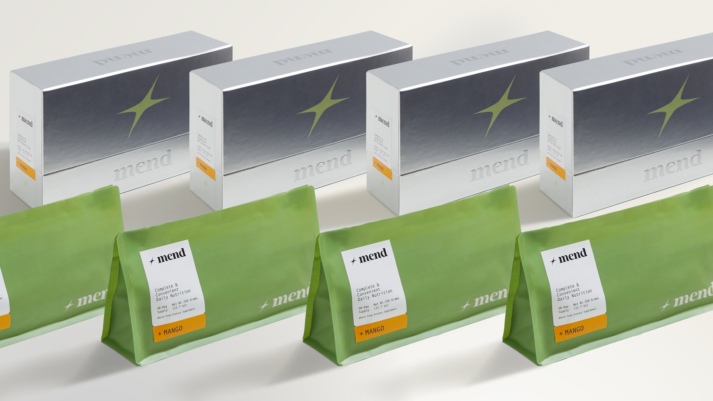 Multiple boxes and pouches of 'mend' brand dietary supplement, mango flavor, arranged on a white surface.