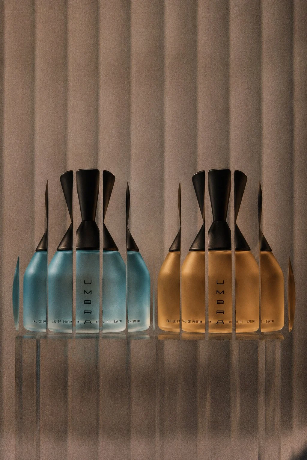Experimental mirrored product photography for UMBRA perfume bottles