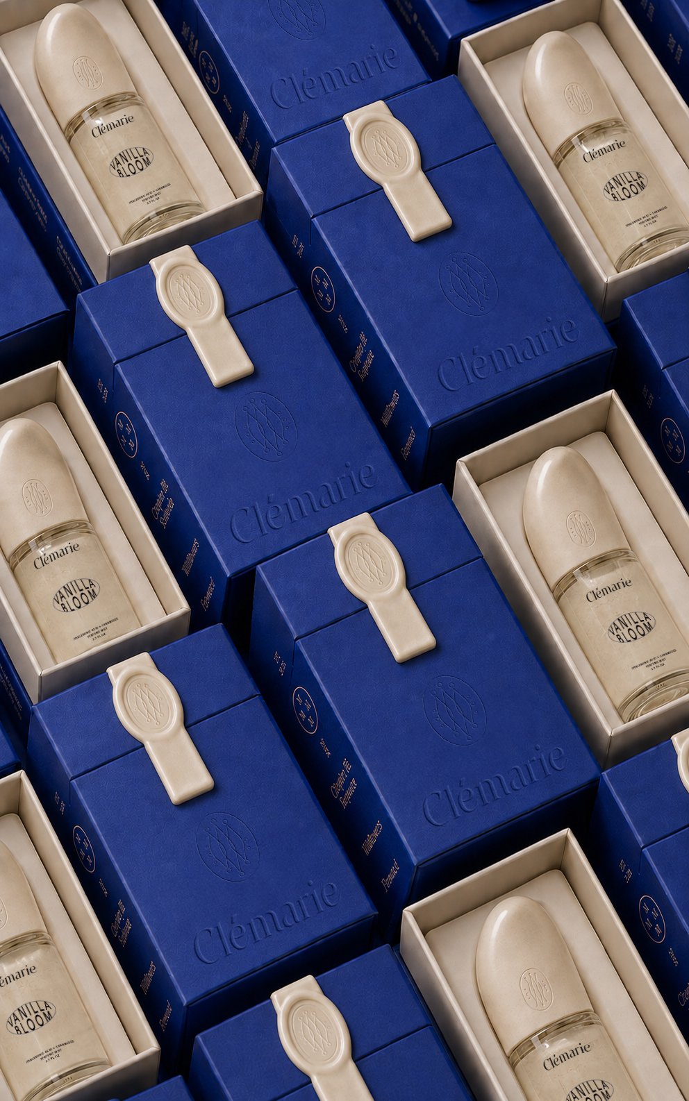 Blue Clémarie presentation boxes with cream-colored product inserts