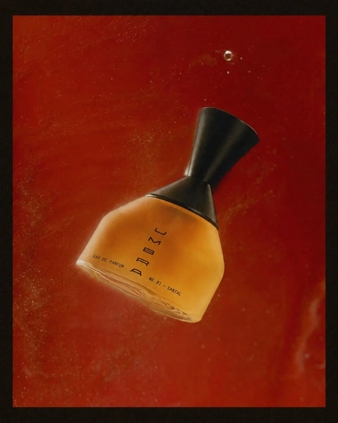 Experimental mirrored product photography for UMBRA perfume bottles