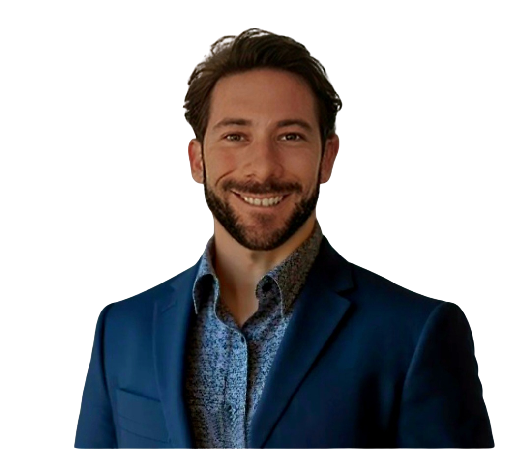 Smiling man in a blue suit and dress shirt.