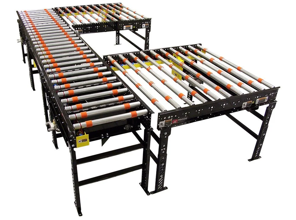 Roach glass and solar conveyor with black frame and orange markings on metal rollers.