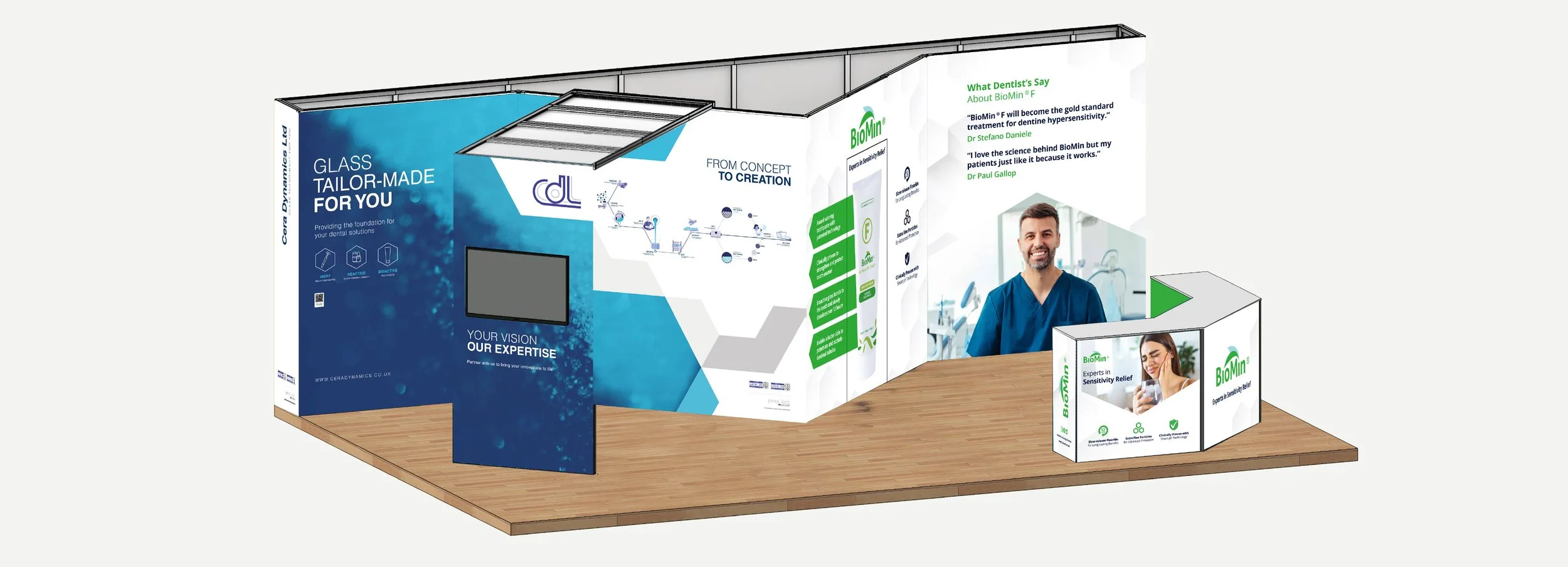 Trade show booth with branding for BioMin, a dental products company, featuring informational posters, a display monitor, and a reception counter with images of smiling people.