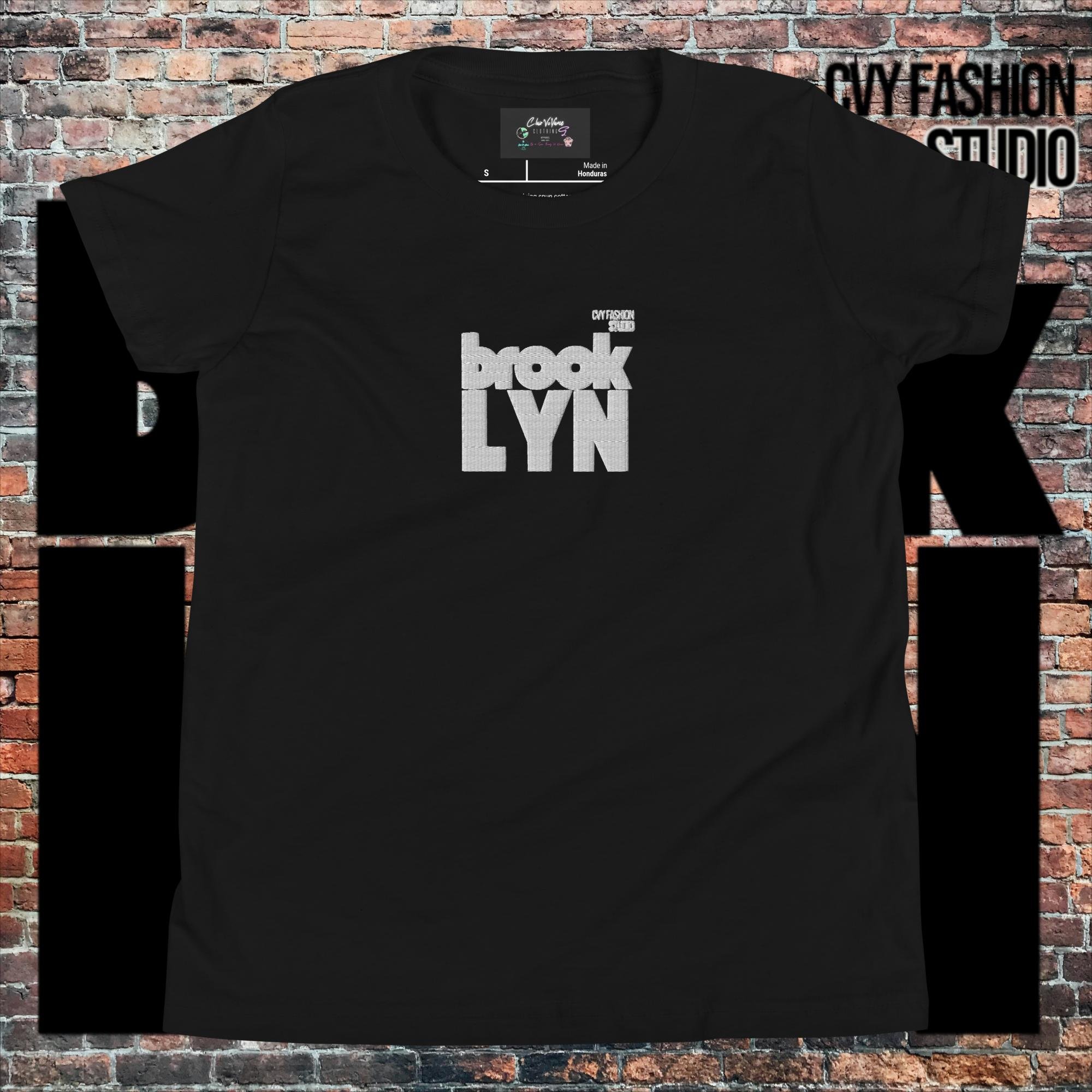 youth-staple-tee-black-front-66059b8a89c9d.jpg
