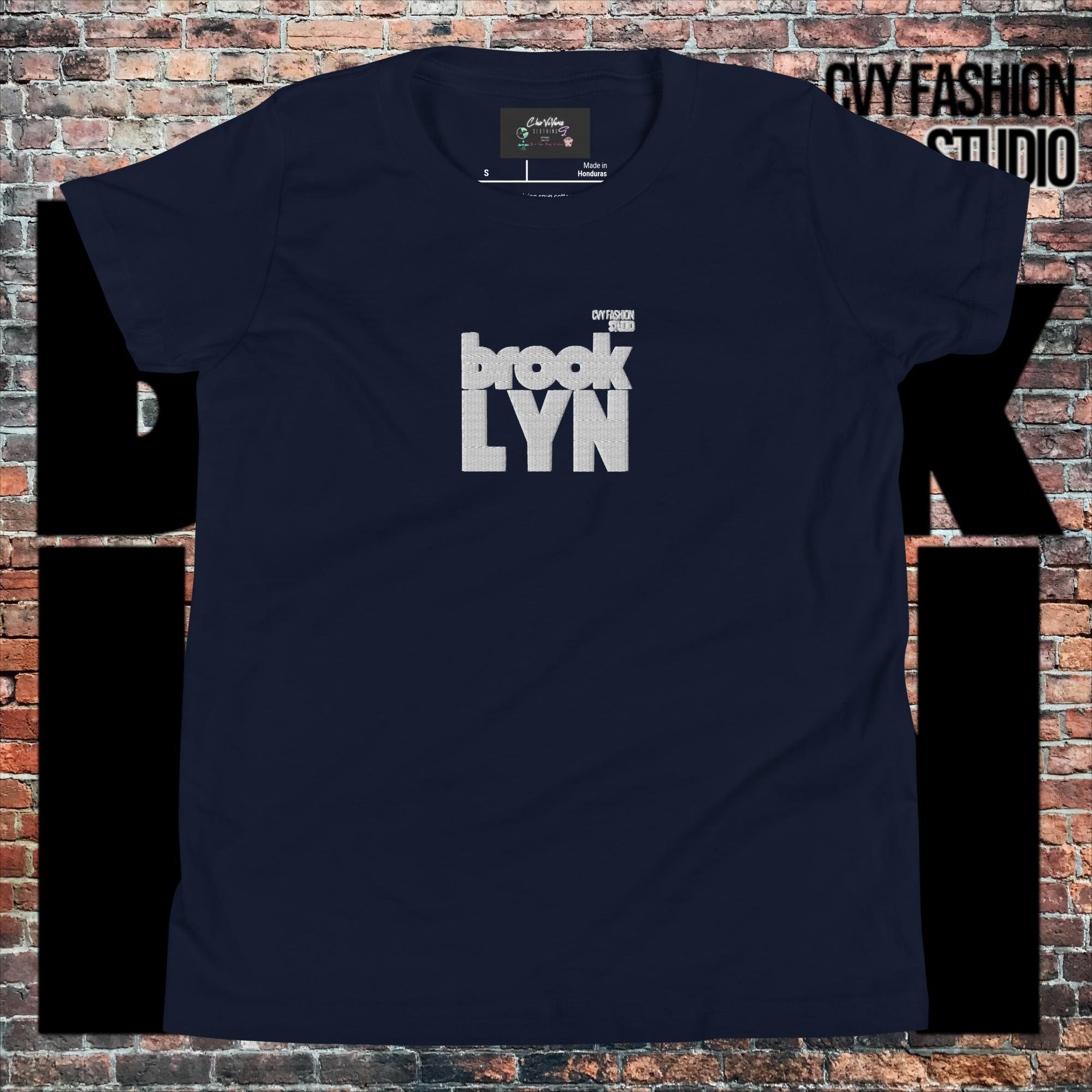 youth-staple-tee-navy-front-66059b8b415ab.jpg