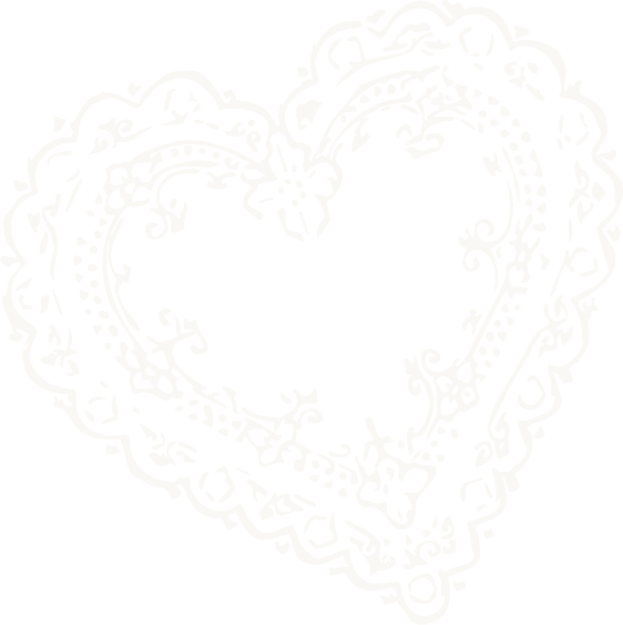 A decorative heart-shaped lace design with intricate floral and swirl patterns.