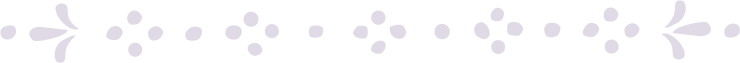 Decorative black and white floral pattern with symmetrical dots and petal shapes.
