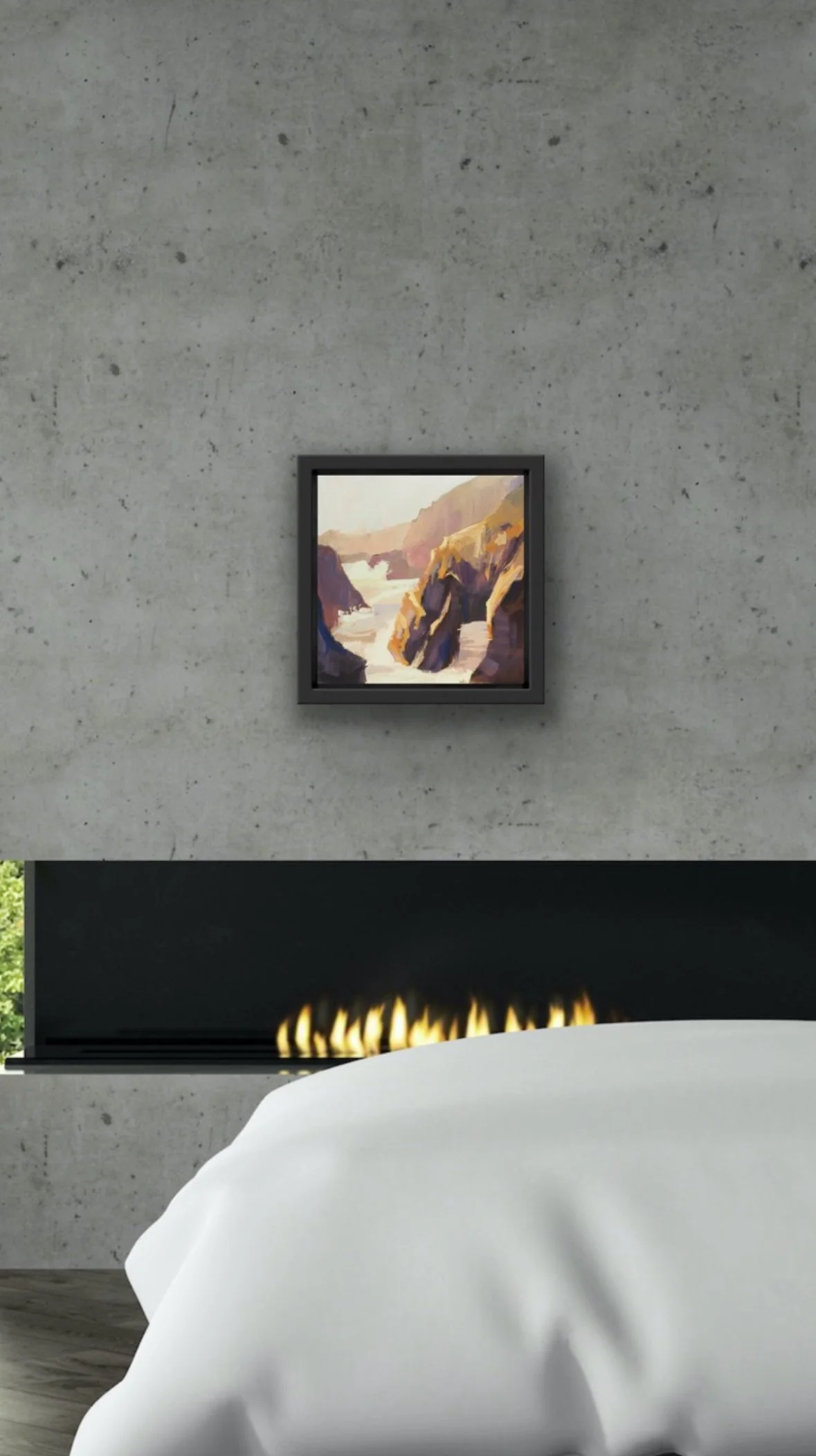 Interior of a modern room with a bed, a concrete wall, a small painting of a canyon landscape, and a fireplace.
