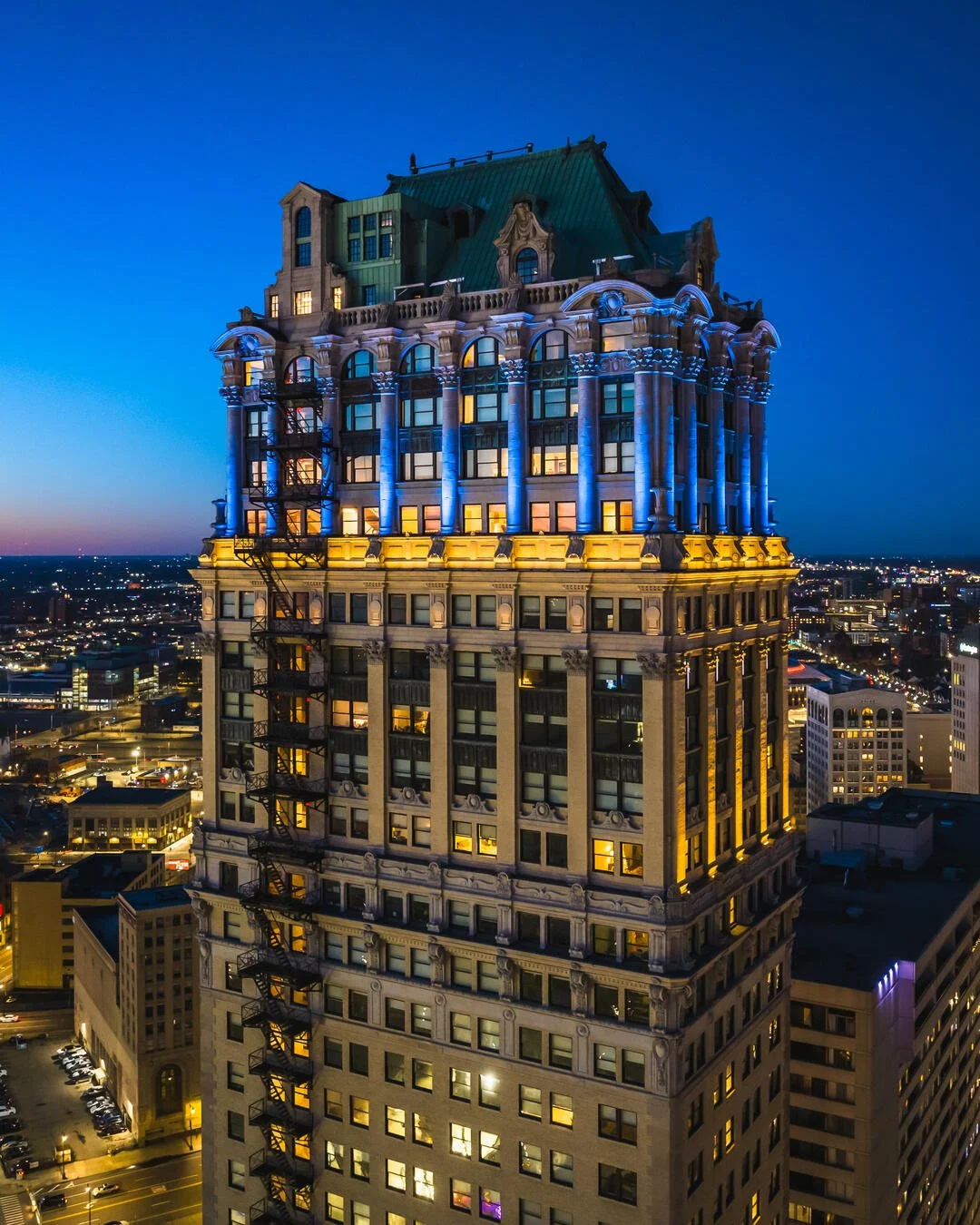Book Tower exterior photo at night with blue lights.