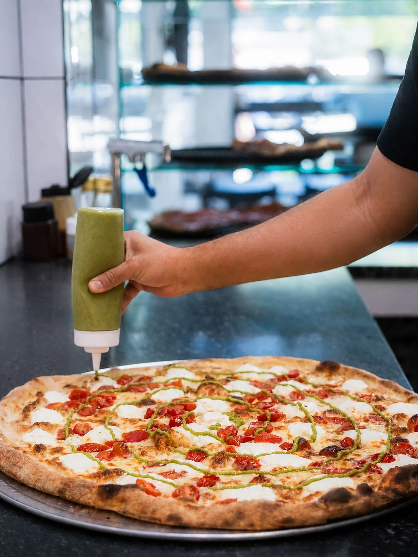 Red sauce takes the day off. This White Pie remix takes over. 🍕✨
Fresh mozzarella, ricotta, pesto, tomatoes, and a sourdough crust.
