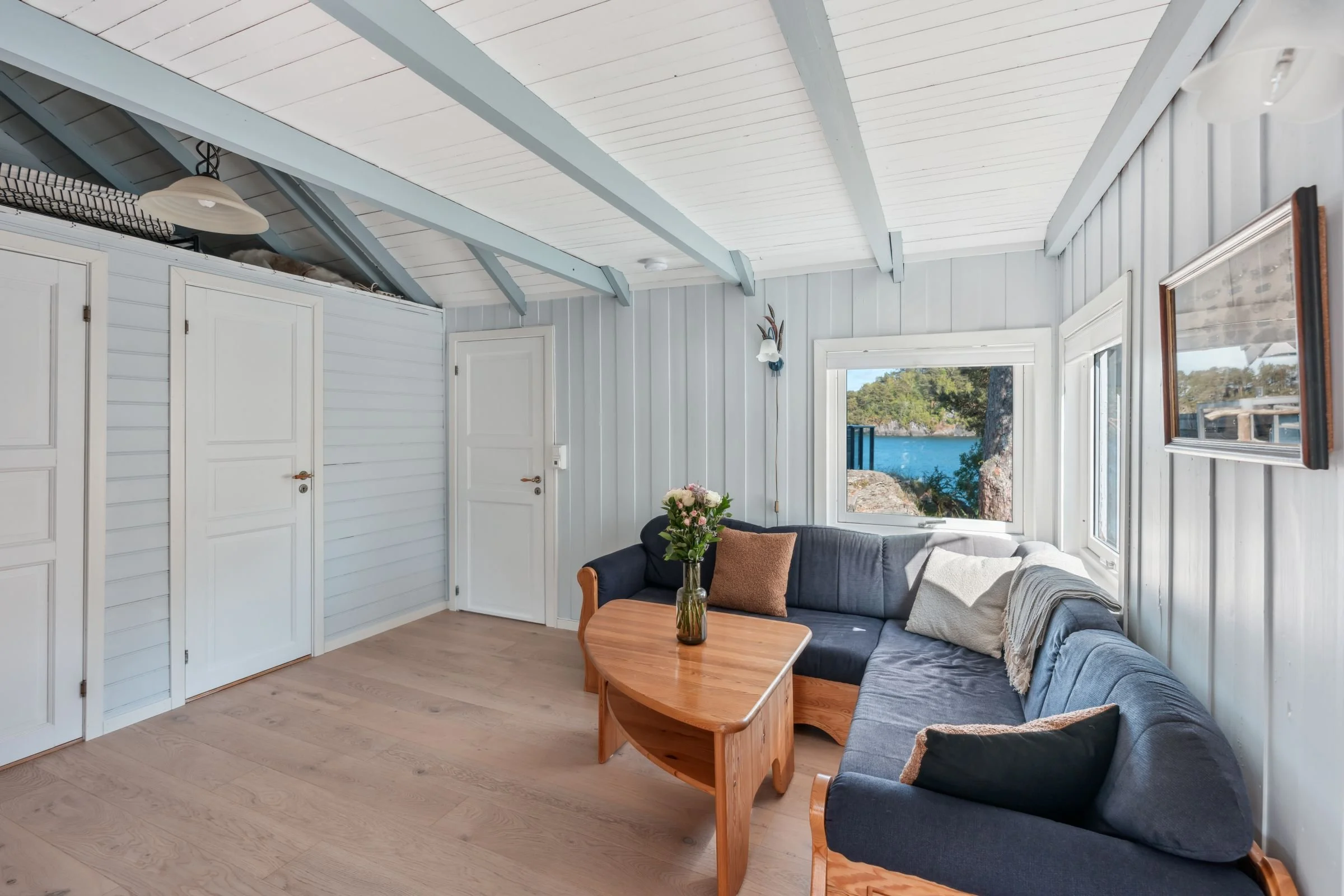 Living room in seaside cabin at Furiholmen with sea view near Bergen