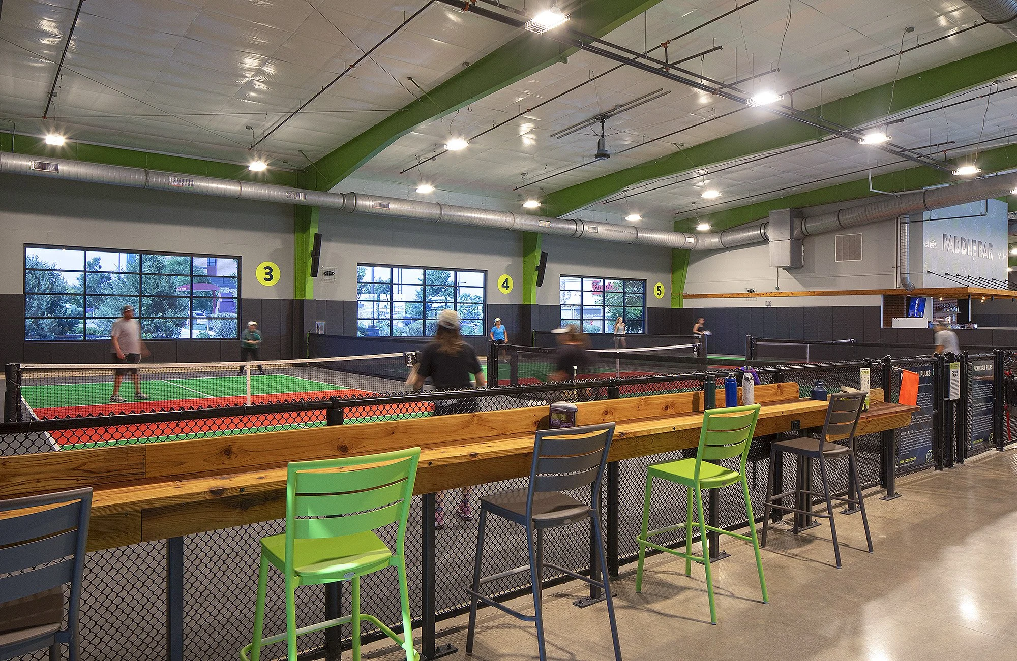 People playing Paddle Ball at Chicken N Pickle Thornton Colorado