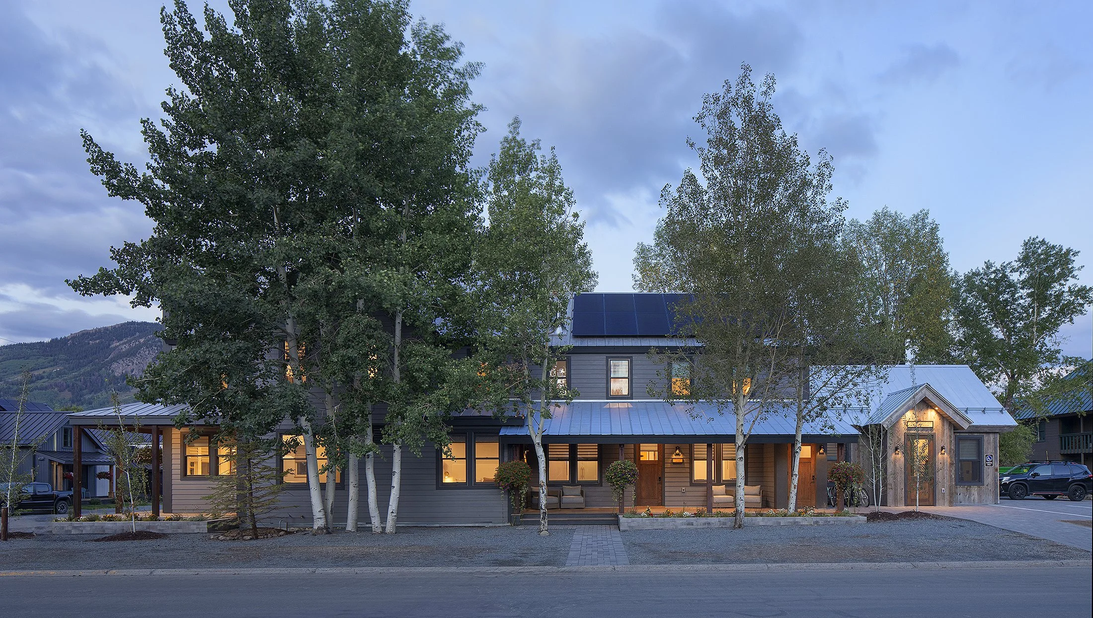 Aspen trees surrounding a boutique hotel at dusk in crested butte Colorado