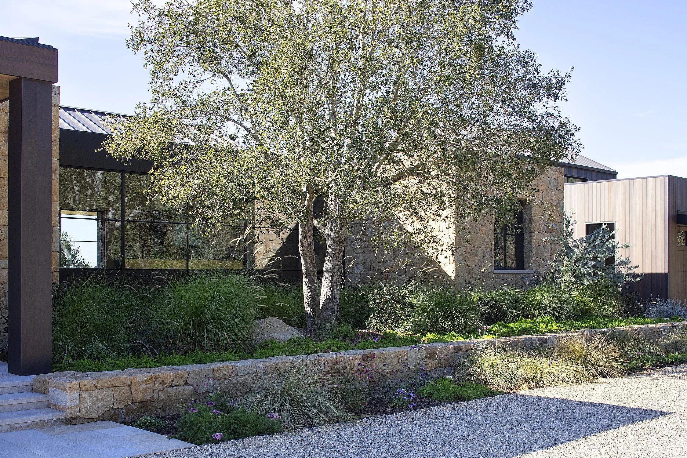 Such garden enclosing a detail of stone facade on a house in Montecito California 