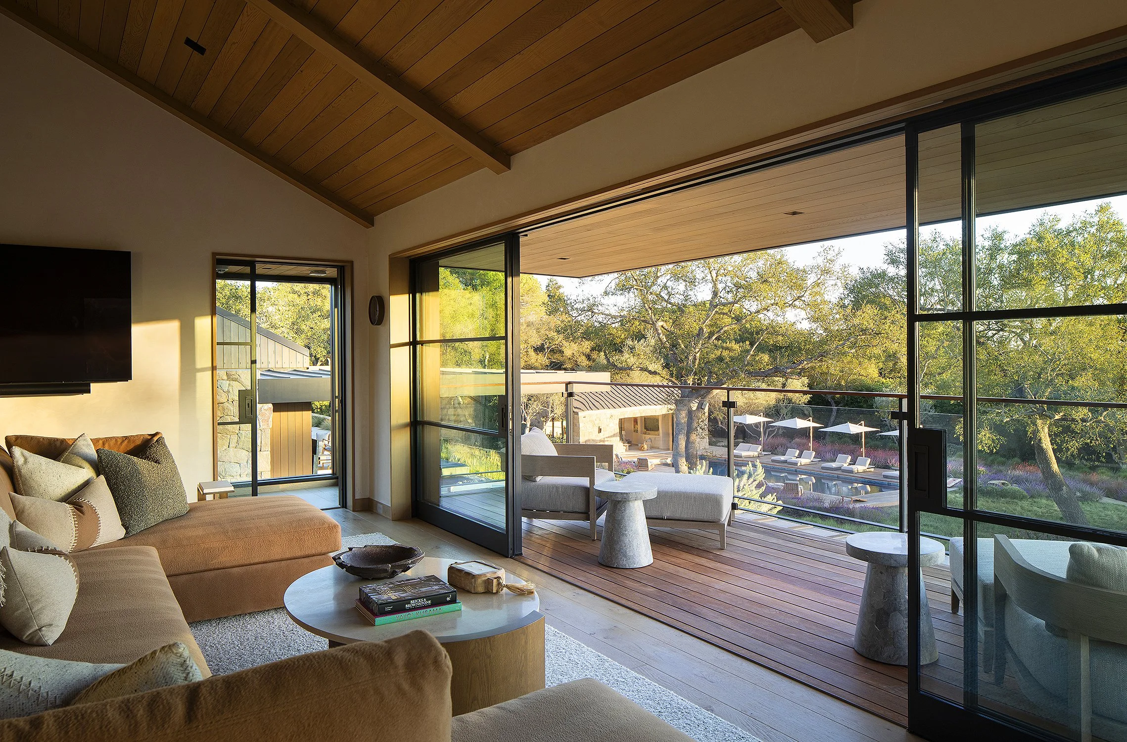 Interior of an office overlooking the pool as the sun sets 