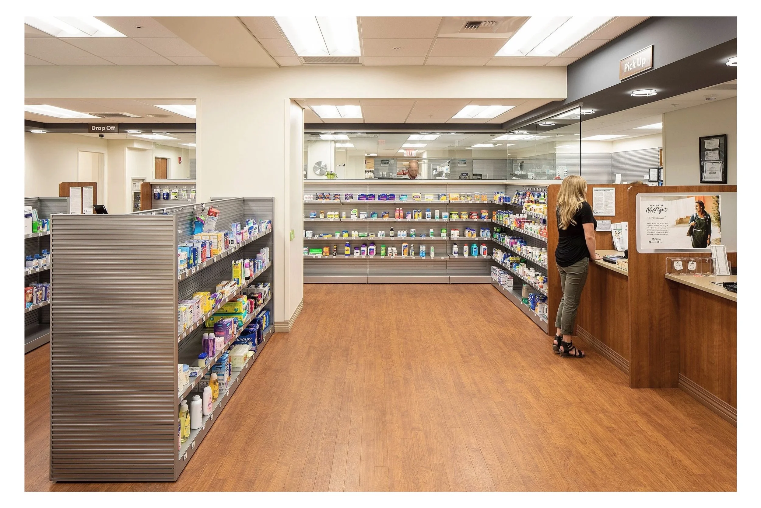 Pharmacy Boulder Colorado with woman at counter 