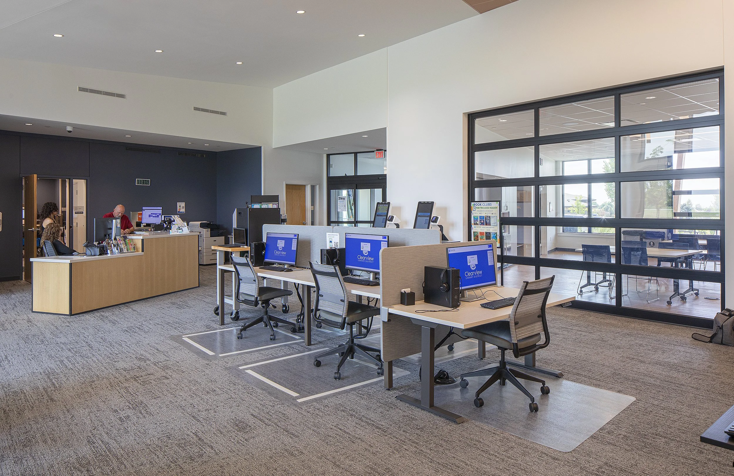 Library with reception and three workstations with computers 