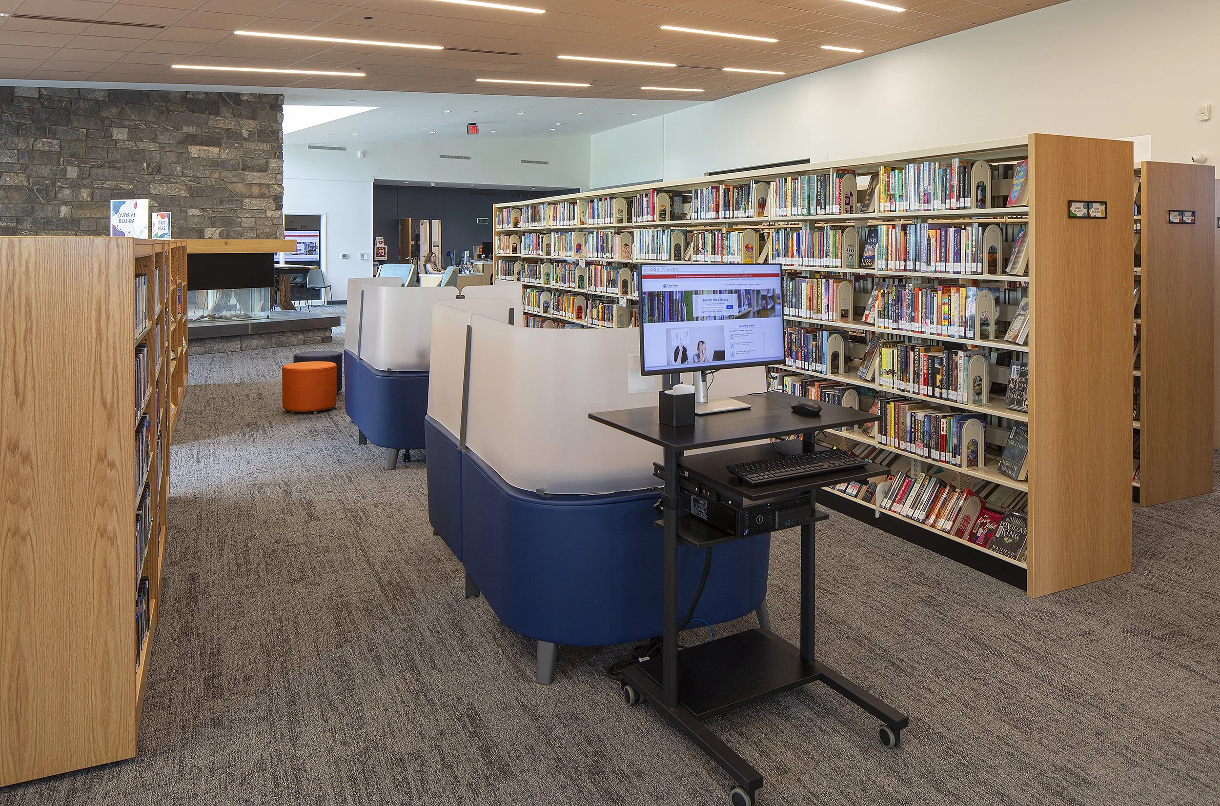 Library with book shelfs and computer with work station