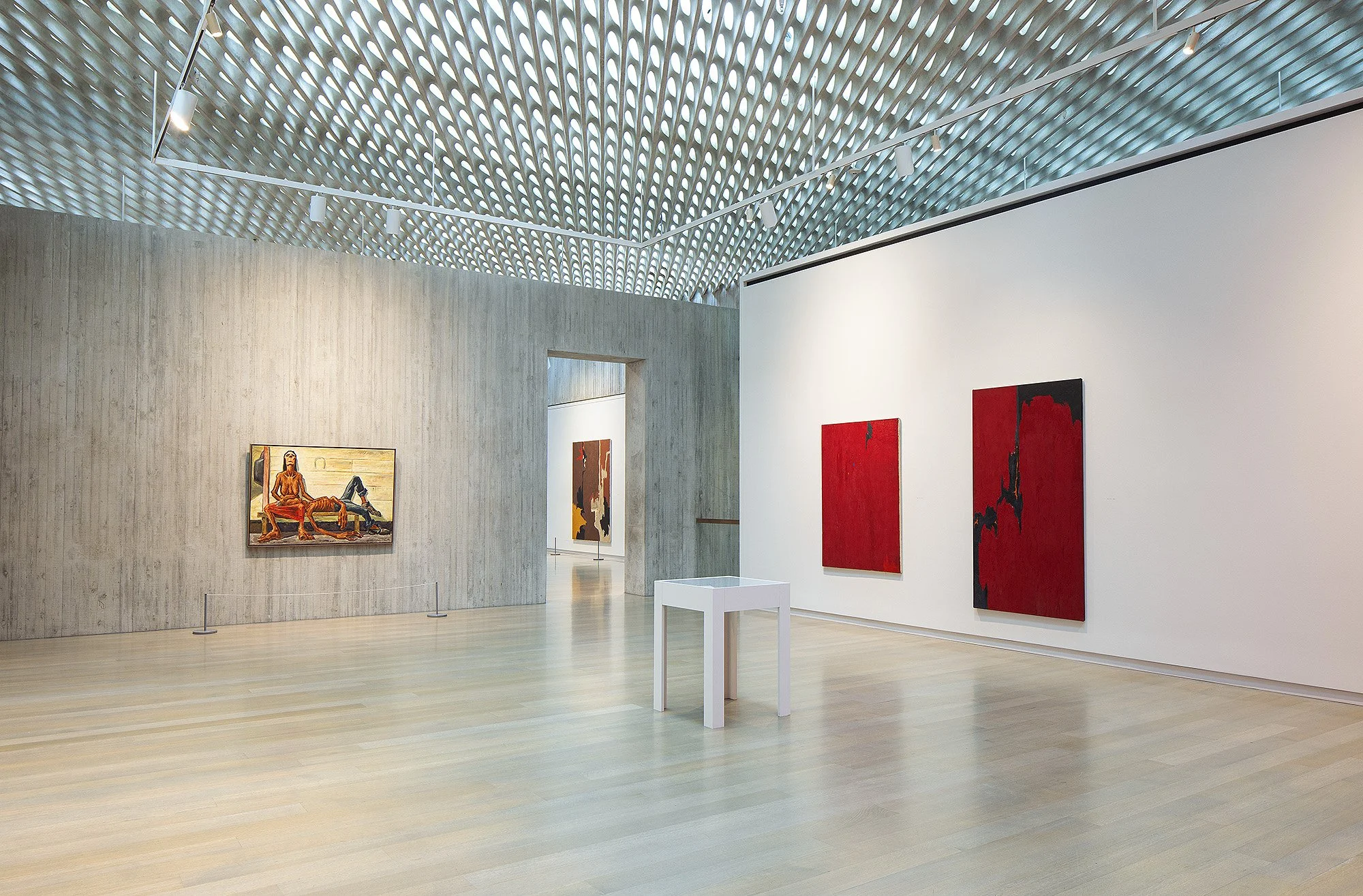 Two red paintings hanging in gallery at Clifford Still museum
