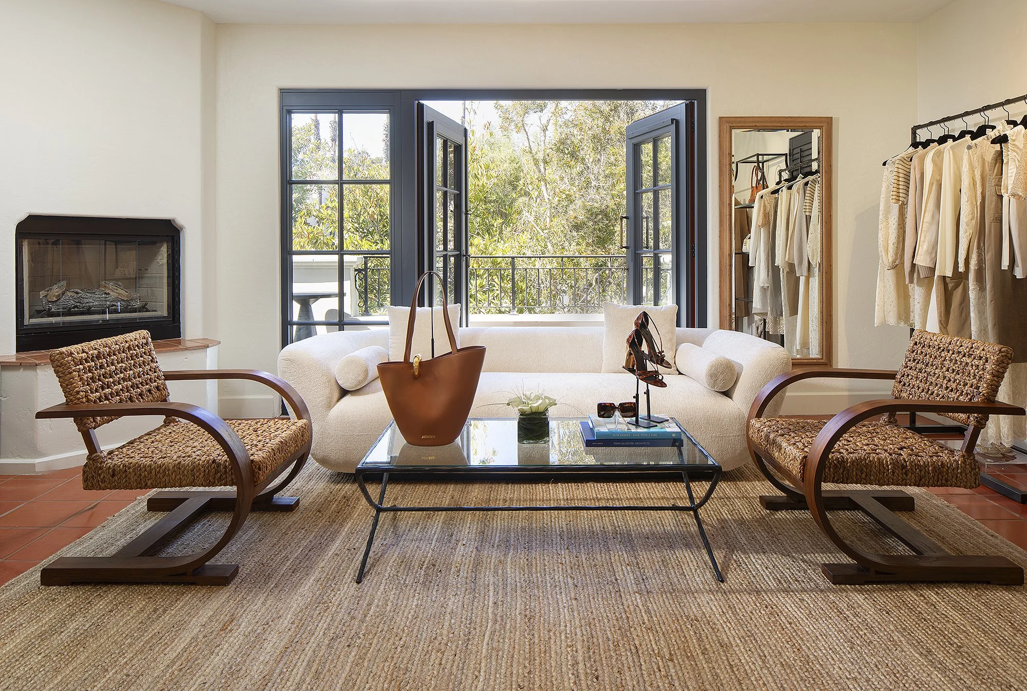 Sacks 5th avenue showroom with white couch and two brown chairs