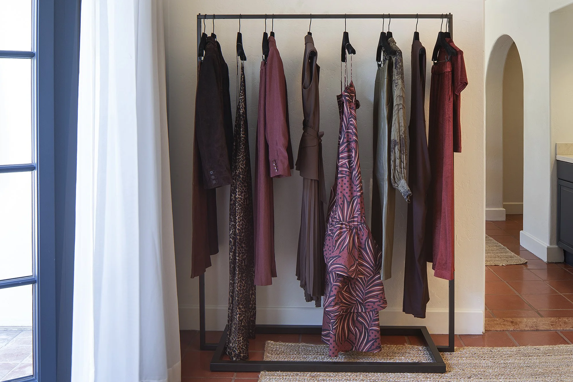 Red dresses displayed on rack in Sacks 5th Avenue showroom Santa Barbara, California 