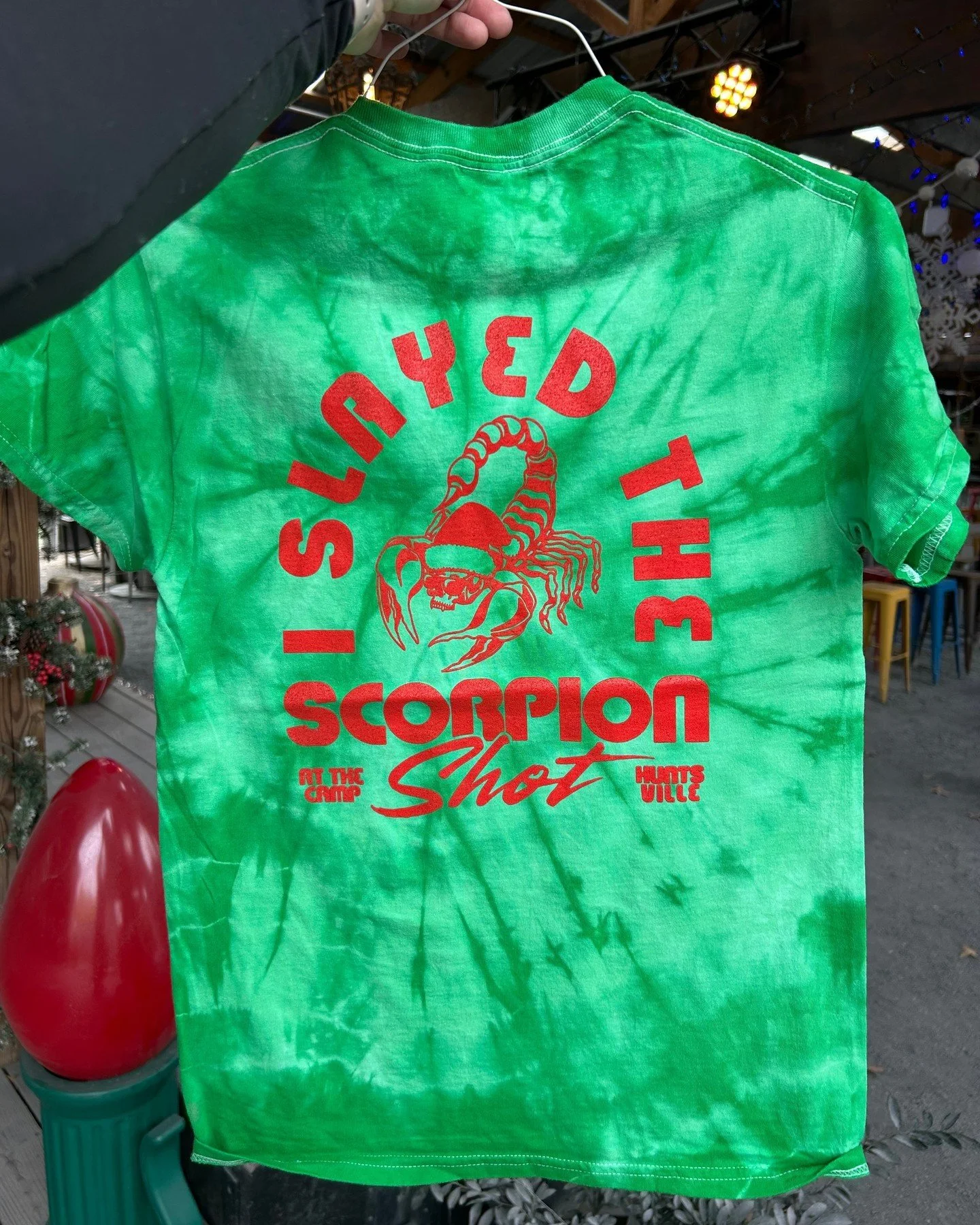 Slay the scorpion shot - get a dope holiday edition shirt while supplies last!!! 🦂🥃💚❤️