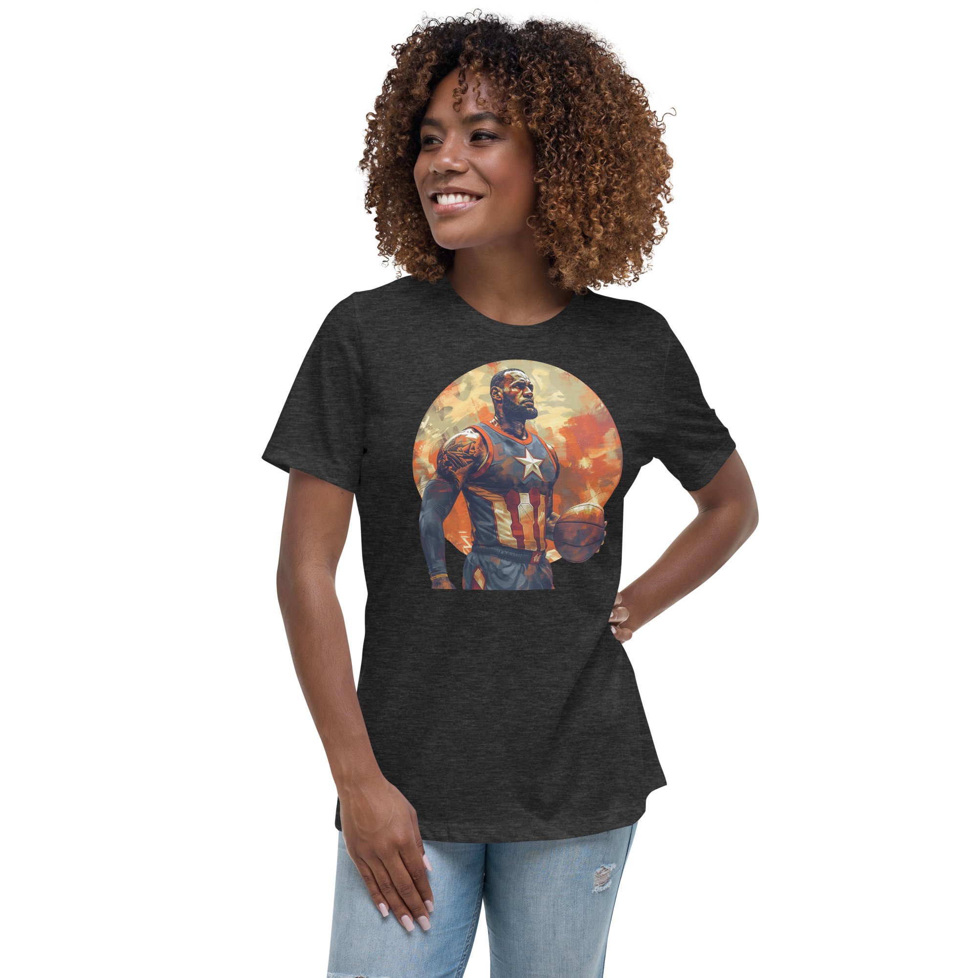 Woman wearing a black T-shirt featuring an athletic superhero holding a basketball, with a star on the chest and a patriotic theme. She stands smiling, with her hand on her hip, wearing light blue jeans.