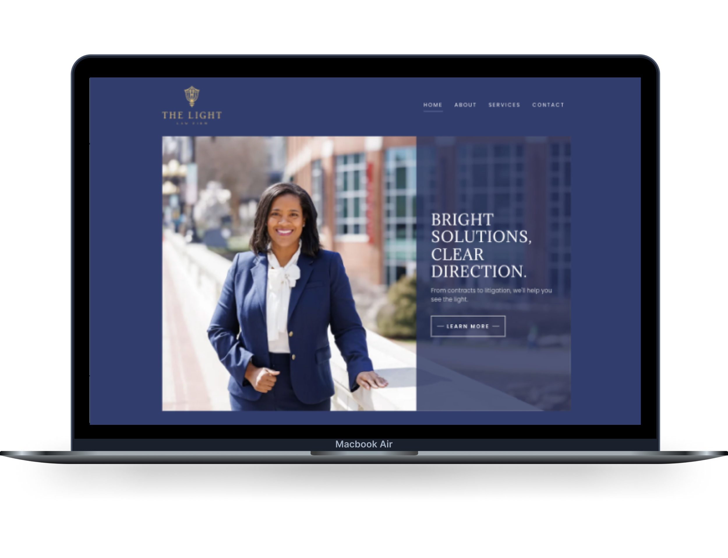 A woman smiling and dressed in a blue suit standing outside in front of a building on a sunny day on a MacBook Air screen displaying a law firm's website.