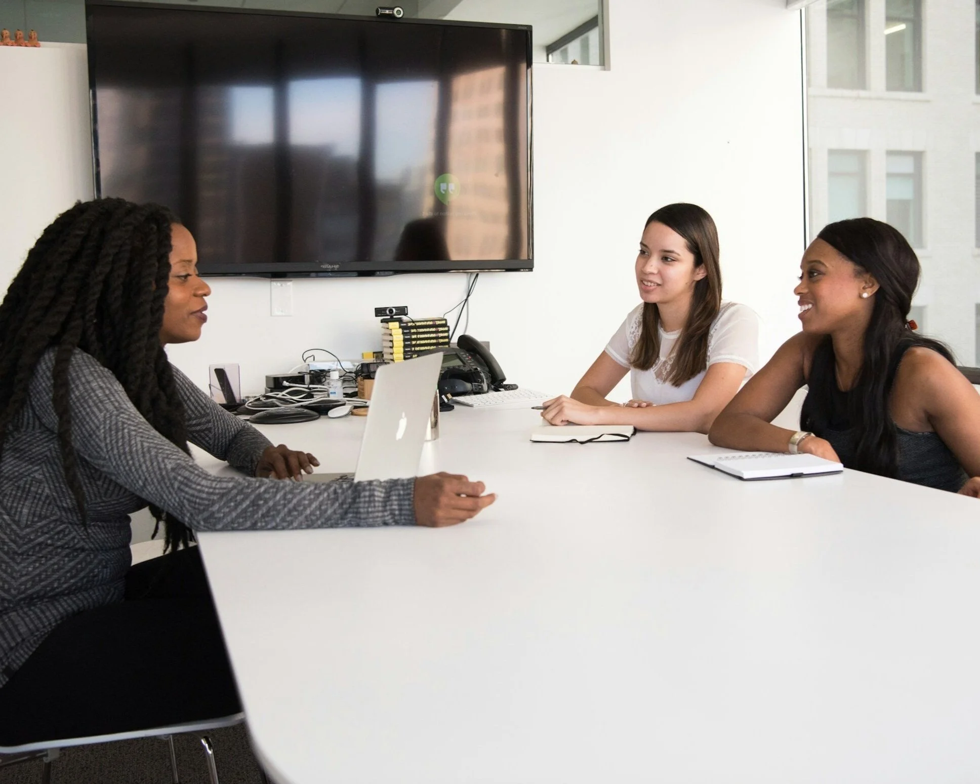 sideview of small business meeting with three women