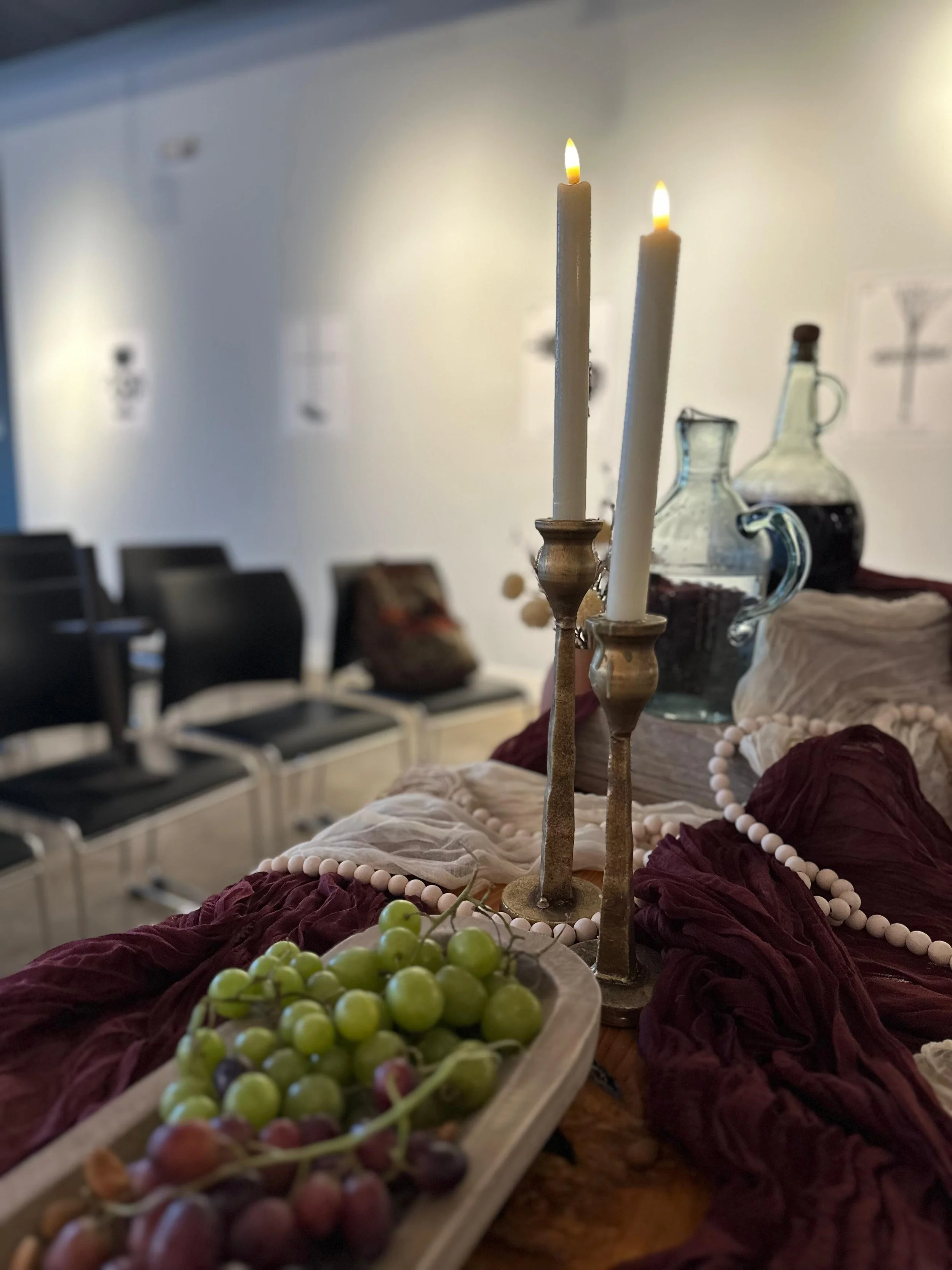 GRAPES, WATER AND WINE SYMBOLIZING CHRIST'S BLOOD.