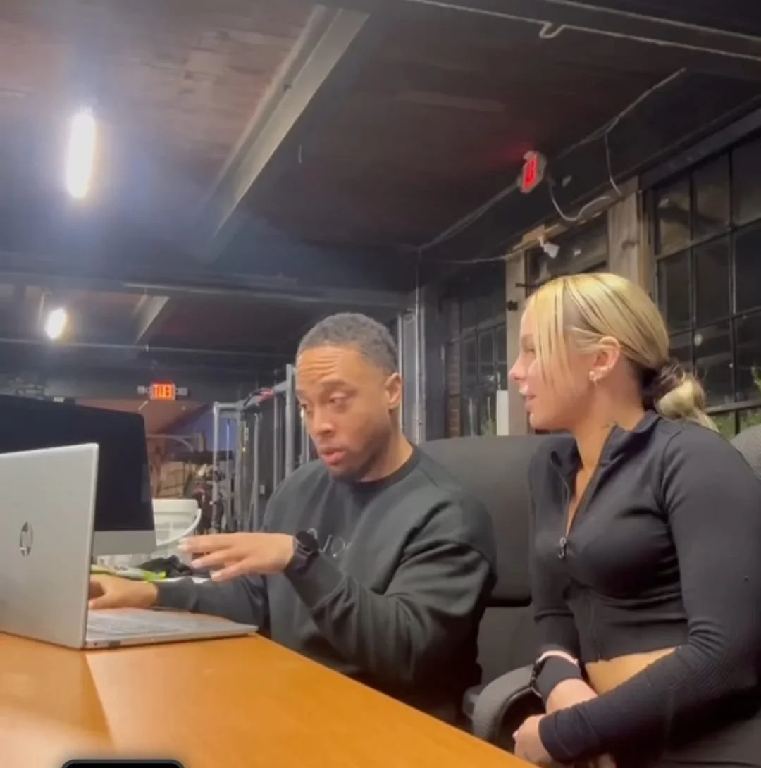 a man and girl looking at laptop