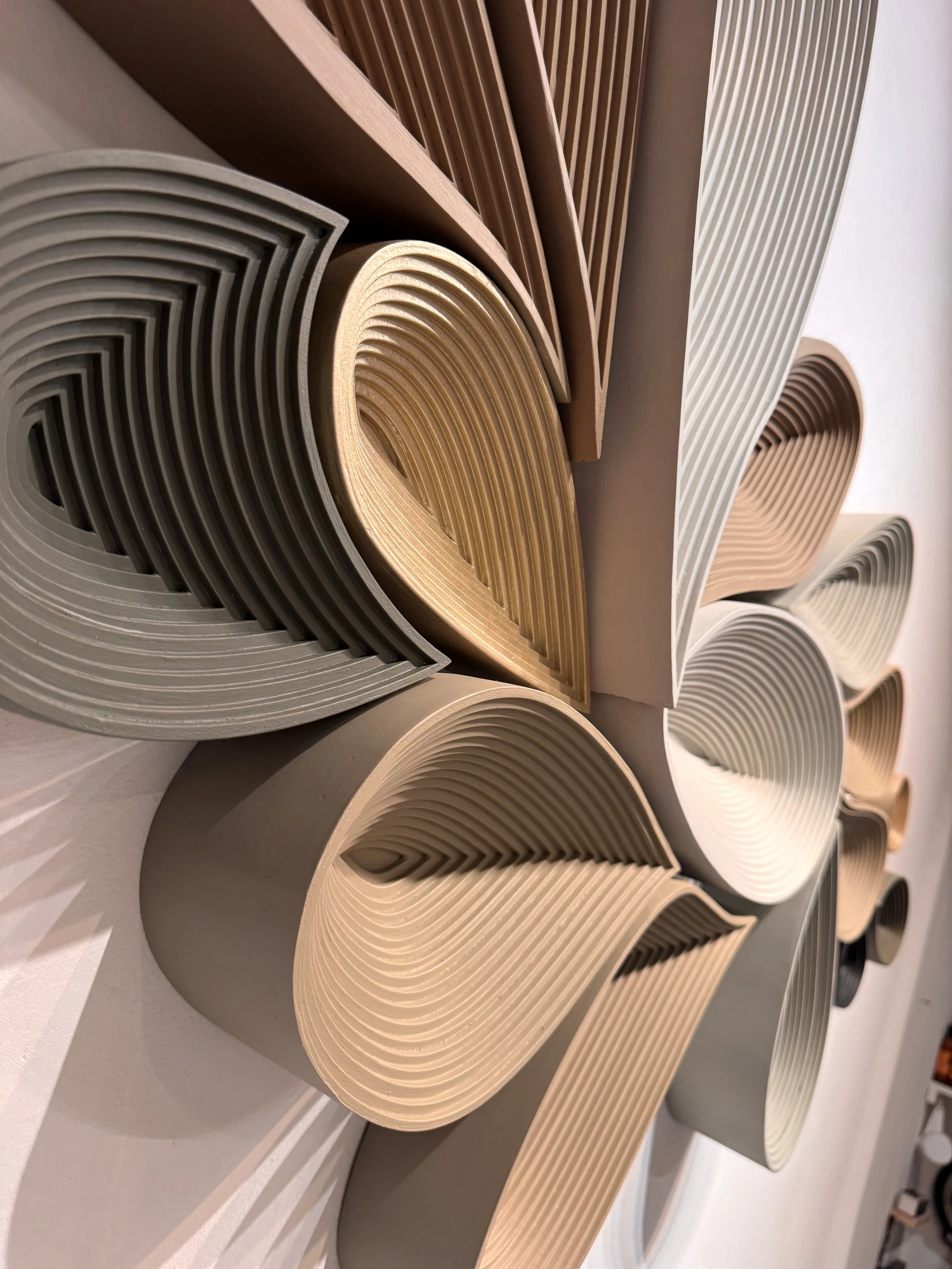 Large scale neutral wall sculpture A Long Way to Still by Jennifer Haley installed in modern minimalist interior, 81 inches wide with architectural presence.