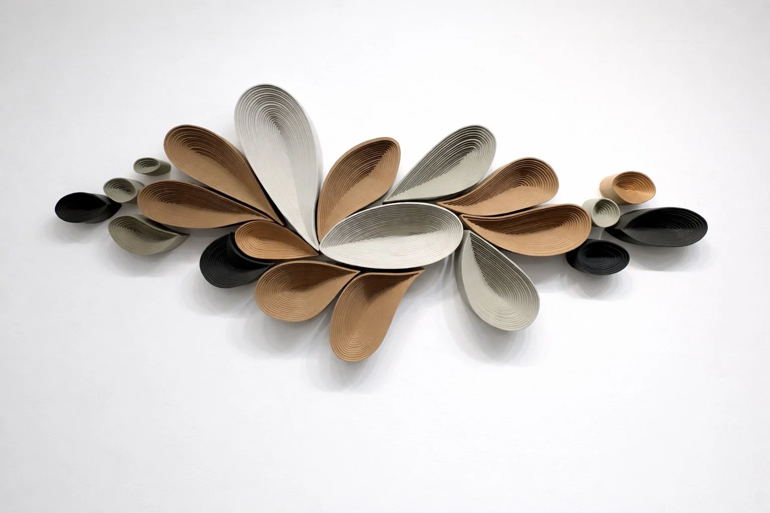 Close-up of A Long Way to Still by Jennifer Haley, contemporary layered wall sculpture with soft neutral tones and 5 inch dimensional depth casting sculptural shadows.