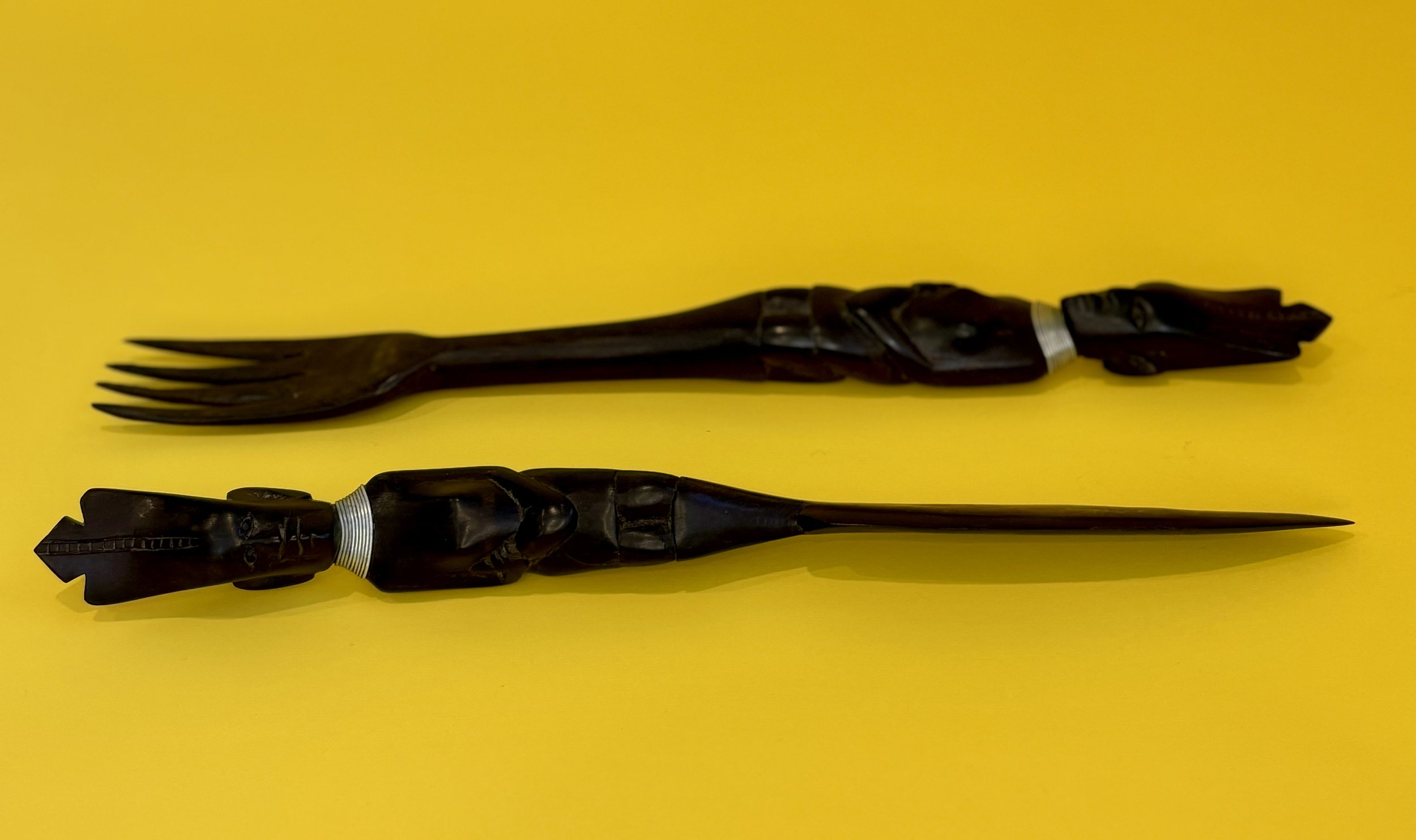 EBONY SERVING UTENSILS are hand carved in Africa, and no two sets are alike. 