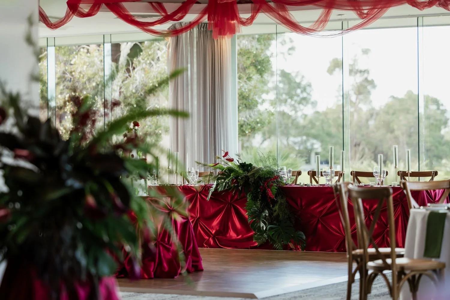 Luxury burgundy bridal table with cascading florals at The Vines Resort