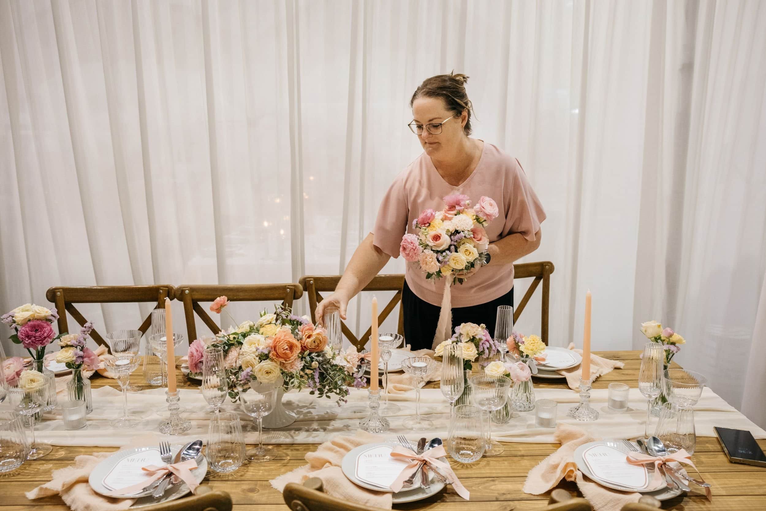 wedding day coordinator perth setting up a wedding reception table