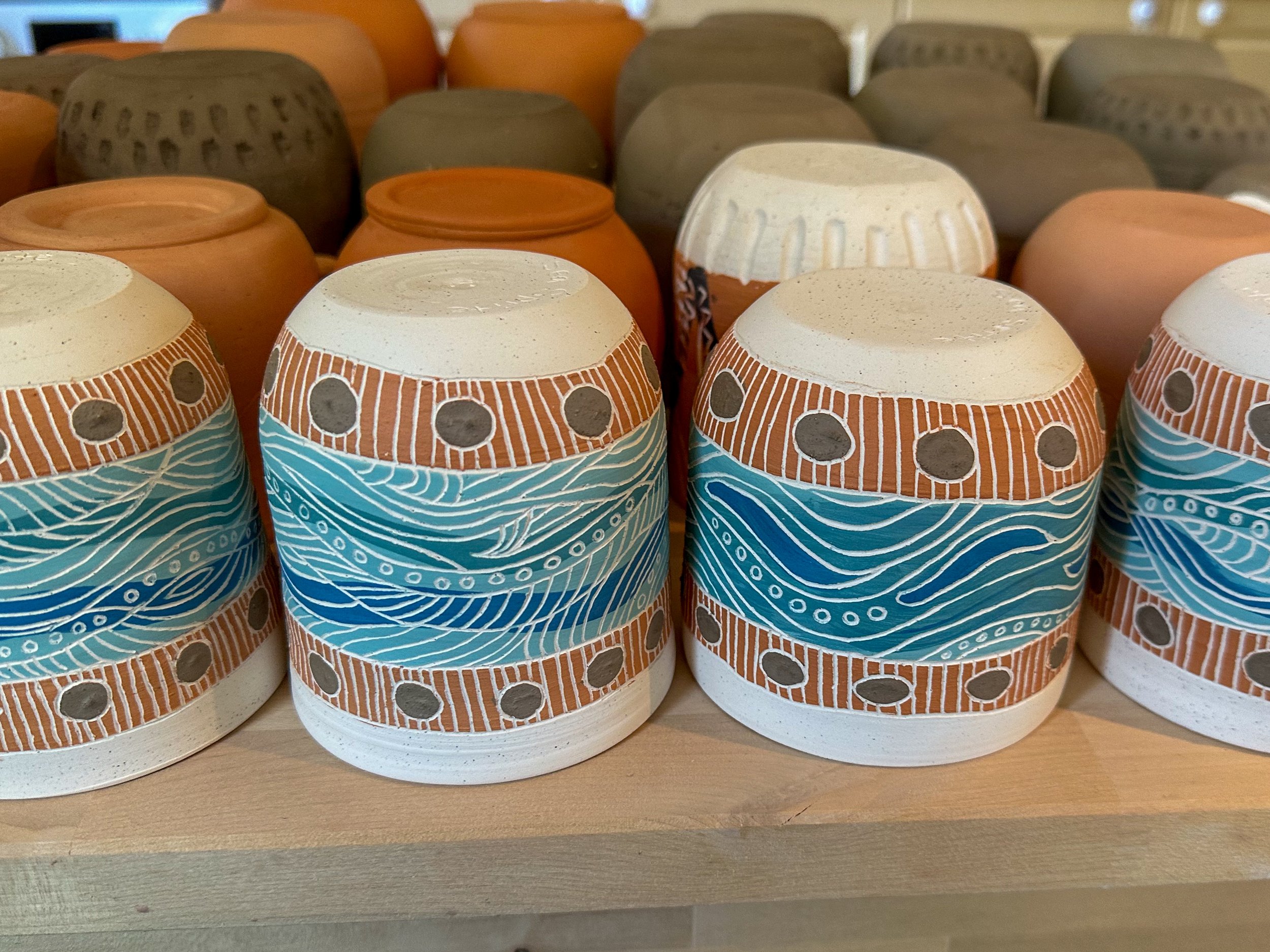 This surface decoration technique is called Sgraffito, it is a lengthy process but one I find quite therapeutic.