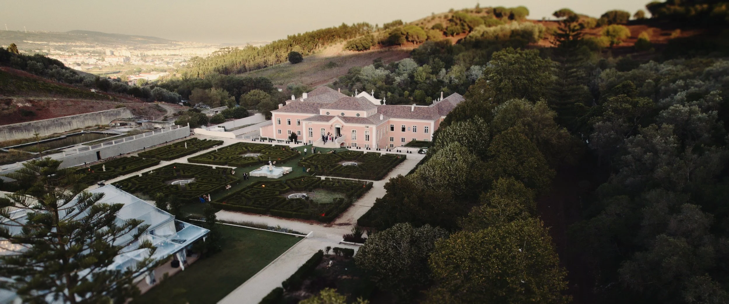 Aerial view of the maze gardens and Palácio do Correio-Mor in Portugal. Luxury destination wedding venue captured by Maru Films.