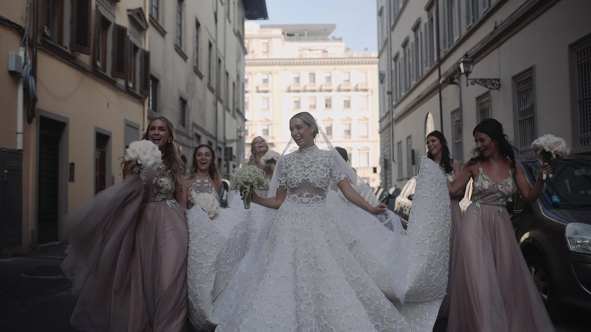 High-fashion bridal party walking through the streets of Florence, Italy. Editorial wedding cinematography by Maru Films.